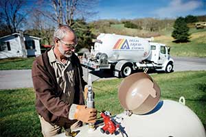 Propane delivery specialist completing Residential Propane Delivery