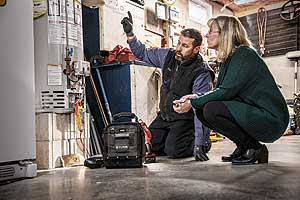 Service technician servicing a residential propane appliance