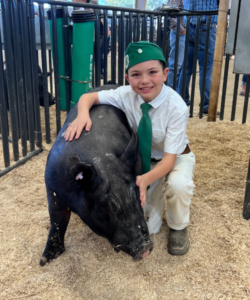 Trigg Jensen of Pozo 4H with his pig at 2023 California Mid-State Fair. 