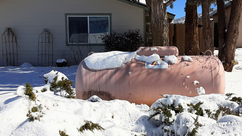 Winter weather impact on the propane supply chain and how to prepare your propane tank for winter weather - propane tank in the snow