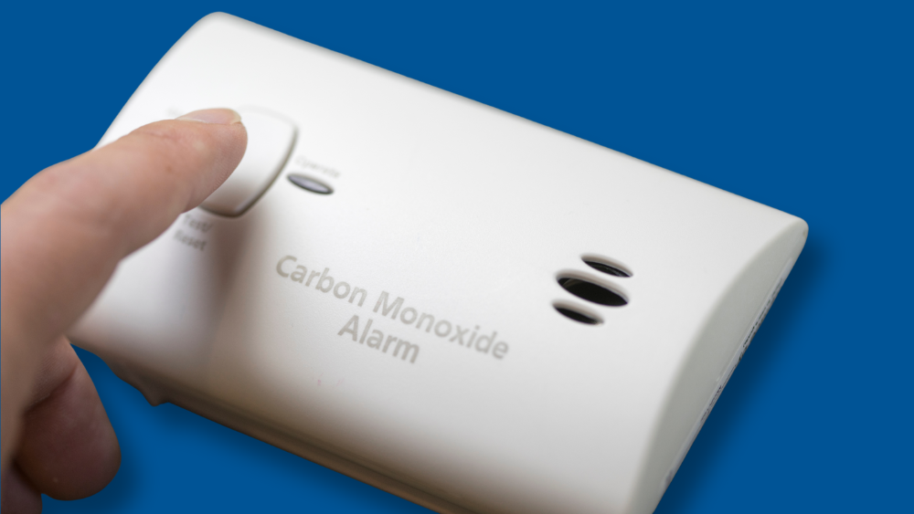 PRESSING BUTTON ON CARBON MONOXIDE ALARM