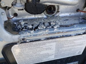 debris from corroded anode in RV water heater